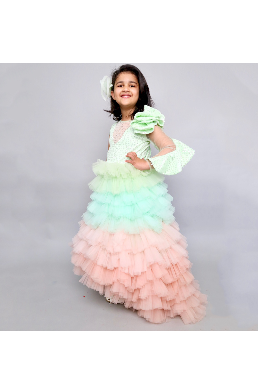 Mint green and peach sequins net ruffle styled gown