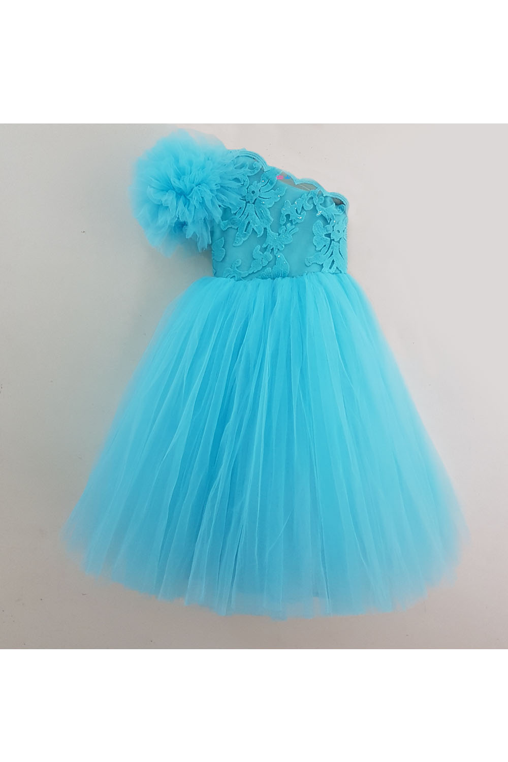 Blue one shoulder embroidered net frilly gown
