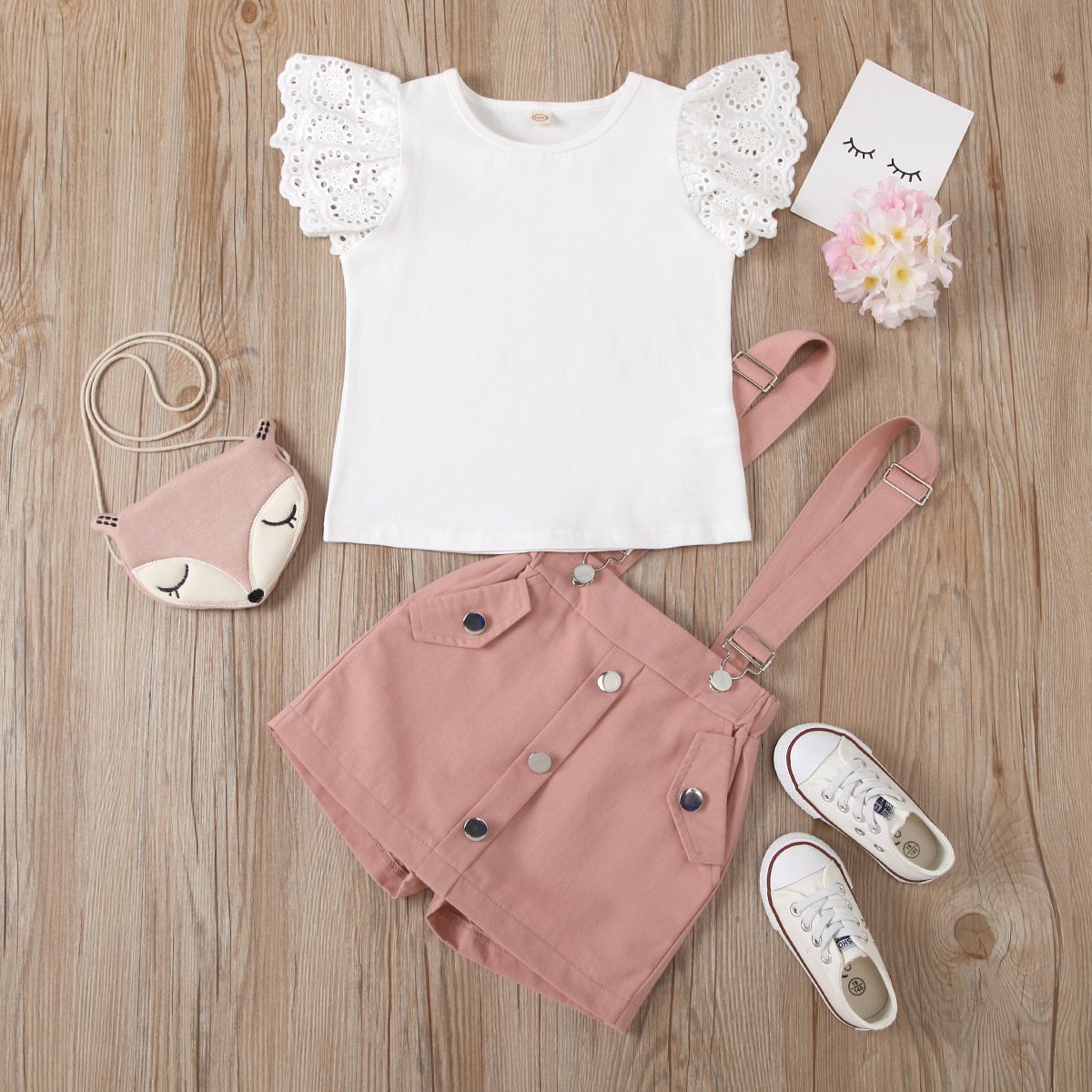 Eyelet top and dungaree shorts set
