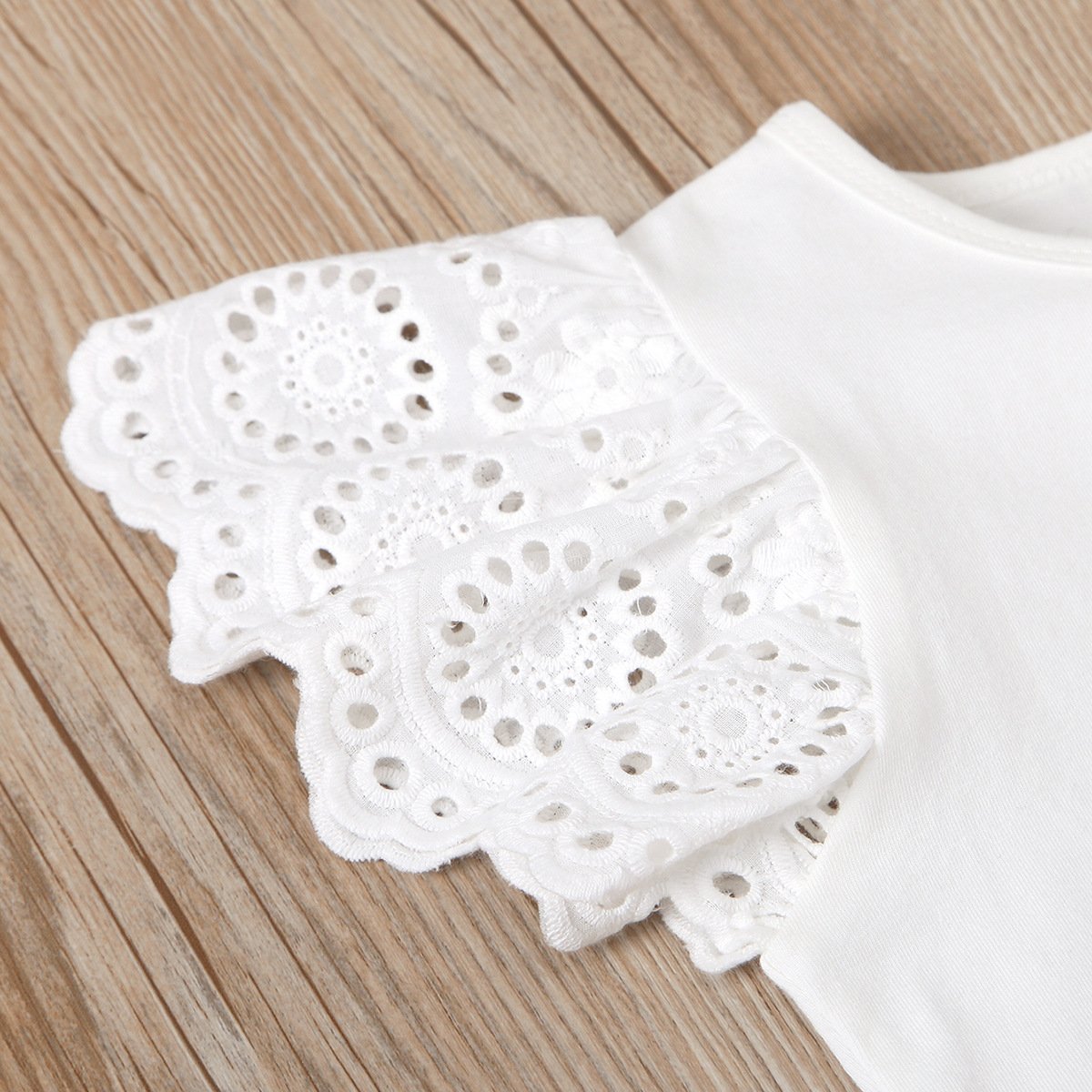 Eyelet top and dungaree shorts set